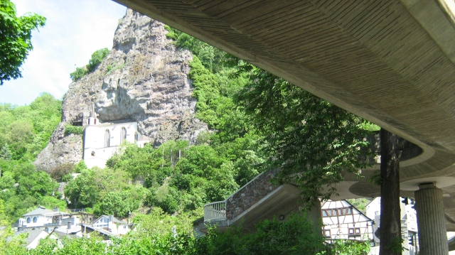 the church in the rock at idar oberstein, also showing a large concrete overpass